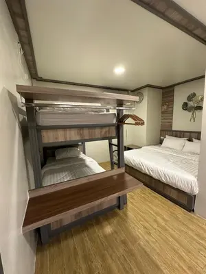 a room with two bunk beds in a room at Victory Place in Bangkok