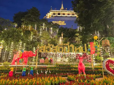 a display of flowers at the magic kingdom at night at Victory Place in Bangkok