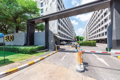 an empty street with a blocked off road at Elio Sukhumvit 64 in Bangkok