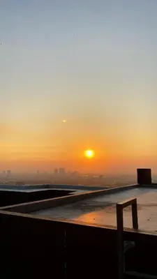 a view of the sunset from the roof of a building at Appartment ASTRO Condo 30 days minimum in Pak Kret