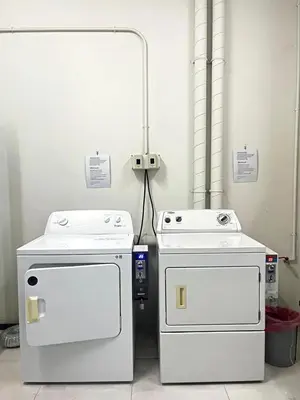 two white appliances are sitting next to each other at Appartment ASTRO Condo 30 days minimum in Pak Kret