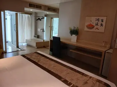 a room with a desk with a chair in it at Palette Hi Hotel Bangkok in Makkasan