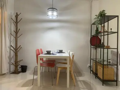 a dining room with a table and chairs at COSY 4th floor with rooftop in Bangkok