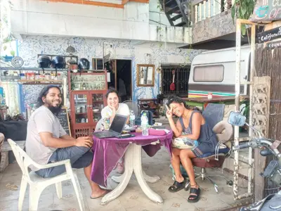 a group of people sitting at a table with a laptop at NP Prime FREE WiFi in Bangkok