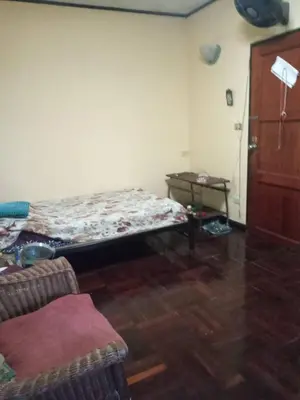 a room with a bed in the corner of a room at NP Prime FREE WiFi in Bangkok