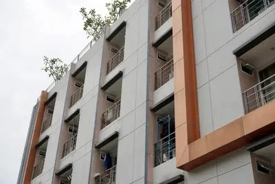 an apartment building with balconies on the side at Hip & Funky Sathon15 apartment close to BTS St Louis in Bangkok