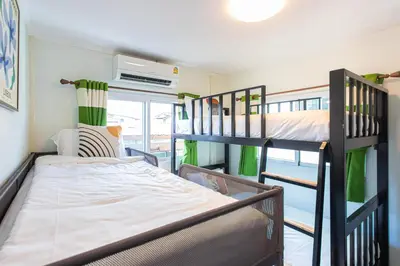 a bunk bed room with two bunk beds in it at Friend House BKK in Bangkok