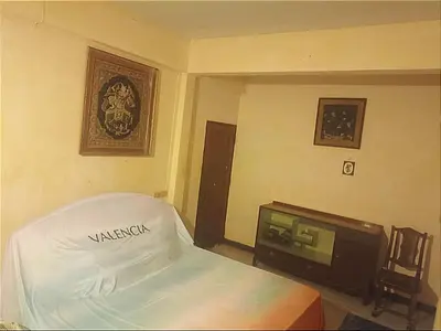 a bedroom with a bed and a tv in it at Best Place Have Air Conditioner in Bangkok