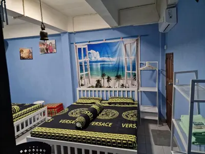 a bedroom with two beds and a window at BTL Sunny in Bang O