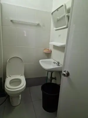 a small bathroom with a toilet and a sink at BTL Sunny in Bang O