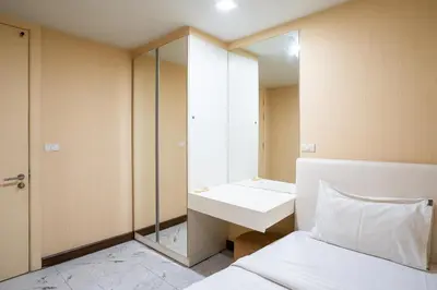 a small bathroom with a sink and a mirror at LIV@5 Condominium in Makkasan