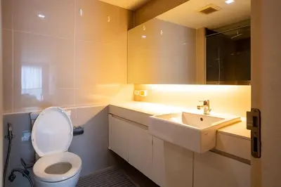 a bathroom with a toilet and a sink at LIV@5 Condominium in Makkasan
