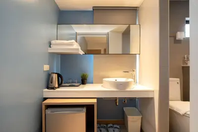 a bathroom with a sink and a mirror at สินสิริ นวมินทร์96 in Ban Baen Phichit