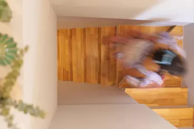 a blurry picture of people in a room at t-t-haus in Bangkok