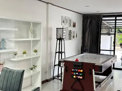 a room with a ping pong table in it at MIQ HK16 - 3BR Huai Khwang MRT with Pool Table near Jodd Fair in Ban Zong Katiam
