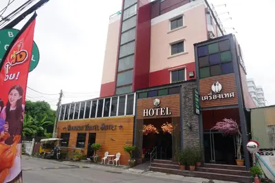 a hotel on the side of a street at Bangkok Travel Suites Hotel in Nonthaburi