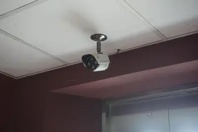 a camera on the ceiling of a room at Bangkok Travel Suites Hotel in Nonthaburi