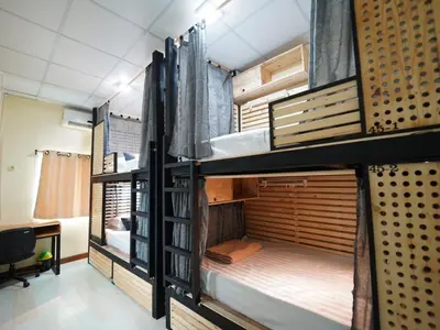 a room with three bunk beds in a room at EZ Sleep @ Ratchada 19 in Bangkok