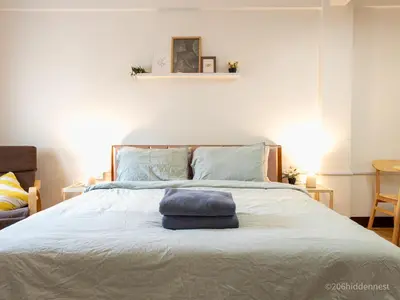 a bedroom with a bed with two towels on it at 206HiddenNest, Local Room with Street Food only 15 min walk to Skytrain in Bangkok