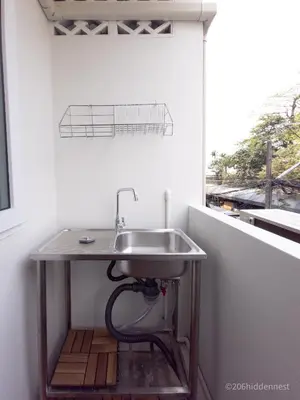 a sink in a room with a window at 206HiddenNest, Local Room with Street Food only 15 min walk to Skytrain in Bangkok
