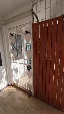 an open door to a balcony with a gate at Chubby 9 single room in Bangkok