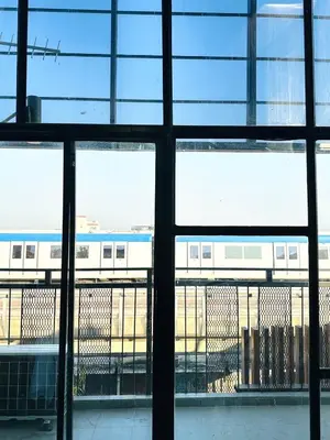 a view of a train through a window at Chubby 9 in Bang O