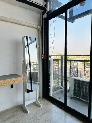 an open door to a balcony with a view at Chubby 9 in Bang O