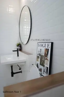 a bathroom with a sink and a toilet and a mirror at TATCHA HOUSE 3BR, Central Westgate, Nonthaburi in Ban Lat Pla Duk
