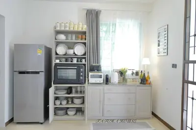a kitchen with a refrigerator and a microwave at TATCHA HOUSE 3BR, Central Westgate, Nonthaburi in Ban Lat Pla Duk