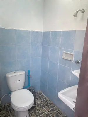 a bathroom with a toilet and a sink and a tub at Suppamas Mansion ศุภมาส แมนชั่น in Bangkok Yai