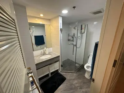 a bathroom with a shower and a sink and a toilet at 2bd Apartment near icon Siam close to Everything in Bangkok