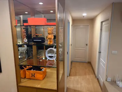 a walk in closet with a glass door at 2bd Apartment near icon Siam close to Everything in Bangkok