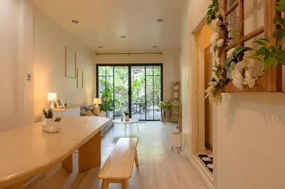 a living room with a table and a dining room at Private house 4bedrooms at Thonglor 4bath5toilet 10people in Bangkok