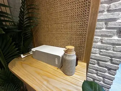 a toaster and a vase sitting on a table at Thai wabi-sabi Loft in Bangkok