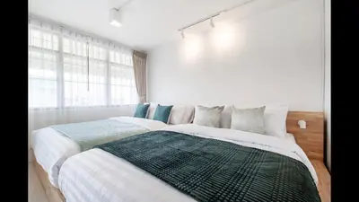 a bedroom with two beds and a large window at 168 House 4A4B 350m BTS Krungton Buri near Icon Siam in Godown
