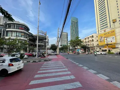 a white car parked on the side of a city street at 168 House 4A4B 350m BTS Krungton Buri near Icon Siam in Godown