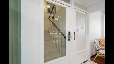 a glass door with a sign that says nothing is no at 168 House 4A4B 350m BTS Krungton Buri near Icon Siam in Godown