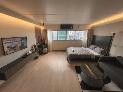 a large room with a bed and a couch at Better Room ห้องพักรายวัน เมืองทองธานี C2 in Nonthaburi