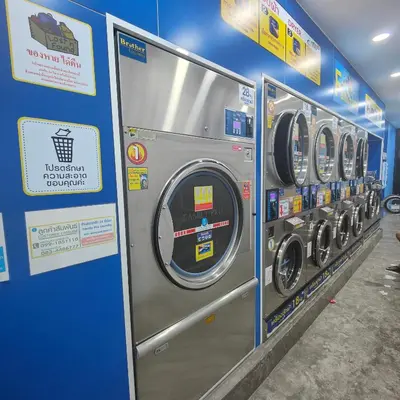 a row of washing machines in a store at 108 Quiet and nice fan apartment with full amenities free Wi-Fi in Bangkok
