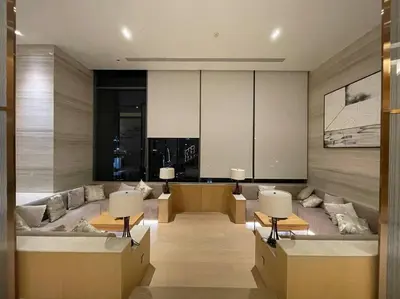 a living room with two tables and a couch at Ultimate Luxurious in Prime Bangkok Asoke in Bangkok