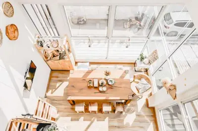 an overhead view of a living room with a table and chairs at Cape Ratchada. in Bangkok