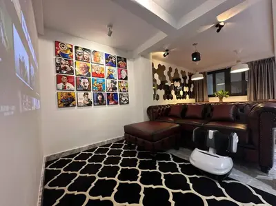 a living room with a leather couch and a rug at Cozy home @ Chatcuchak/中文服务 in Bang O