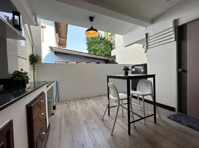 a kitchen with a table and chairs in a room at Cozy home @ Chatcuchak/中文服务 in Bang O