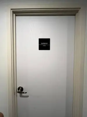 a white door with a sign on it at Nue Z-Square Suan Luang Station - Cozy 2BR Condo, Pool&Gym, Near Suan Luang Station in Bangna