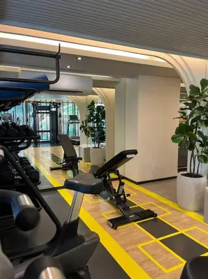 a gym with treadmills and ellipticals in a building at Nue Z-Square Suan Luang Station - Cozy 2BR Condo, Pool&Gym, Near Suan Luang Station in Bangna