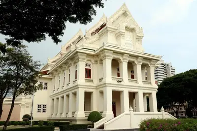 a white building with a tower on top of it at Pinnacle Dream in Bangkok