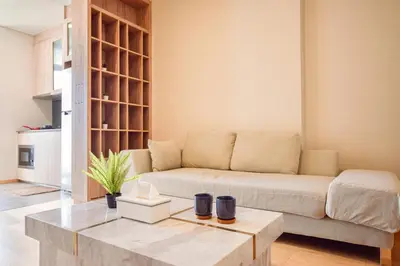 a living room with a couch and a coffee table at BTS Ekkamai-free pool-bus to pattya in Bangkok