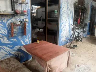 a wooden table in a room with a wall at GN GOOD NICE in Bangkok