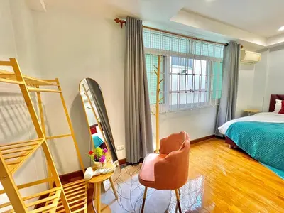 a bedroom with a bed and a chair and a window at S52 Near On nut BTS 300m*7-11 in Phra Khanong