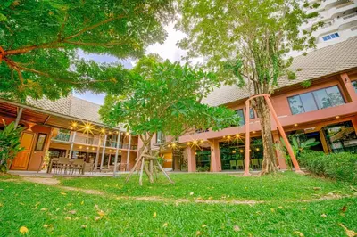 a building with trees in front of it at 189summer villa曼谷中心Asok&Thong Lor顶级豪宅庄园泳池别墅 in Bangkok